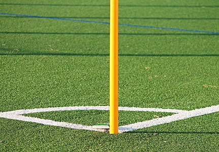 yellow metal pose on sports field thumbnail