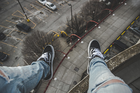 person sitting on building top thumbnail