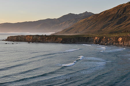 plateau and mountains near body of water thumbnail