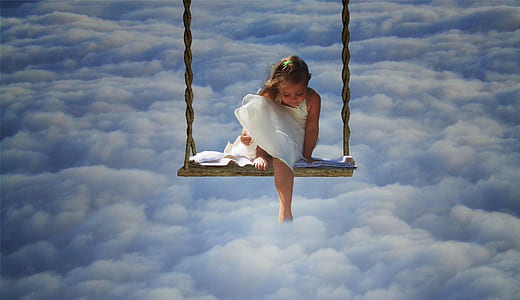 girl sitting on swing thumbnail