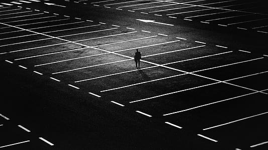 Man Standing on Parking Lot thumbnail