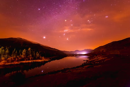 photo of mountain near river with stars thumbnail