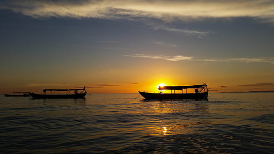 two boats at sea during golden hour thumbnail
