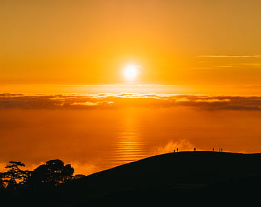 silhouette photo of mountain during sunset thumbnail