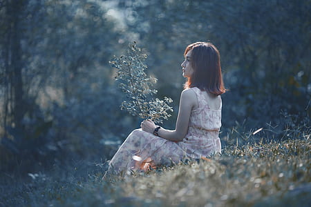 woman sitting on grass thumbnail