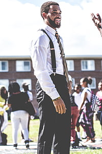 selective focus photography of standing man thumbnail