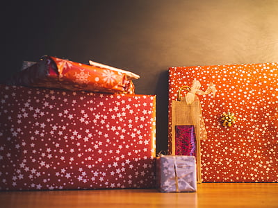 wrapped gifts on brown wooden surface thumbnail
