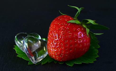 red strawberry on green leaf thumbnail
