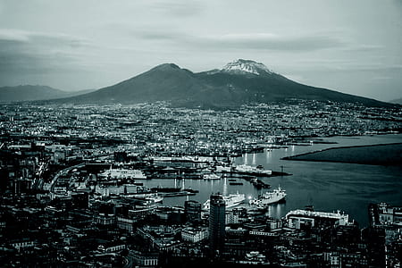 seaside city near mountains at daytime thumbnail