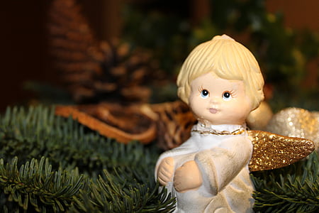 girl in white dress ornament on Christmas tree thumbnail