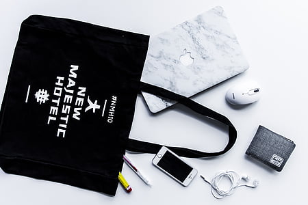 New Majestic Hotel tote bag beside iPhone and charger thumbnail