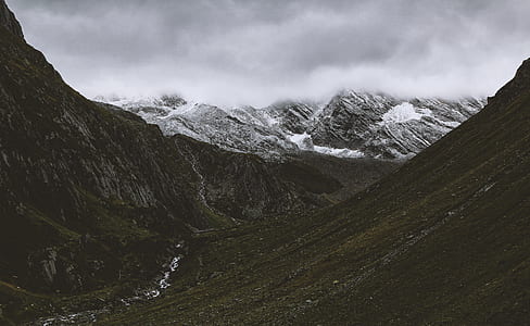 landscape photography of green and snowy mountains thumbnail