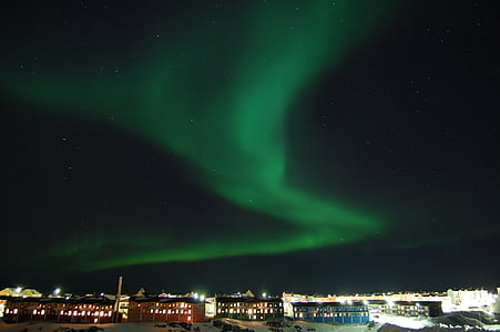 Aurora lights above buildings thumbnail