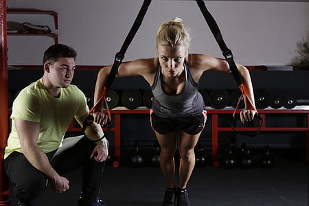woman in gray tank top working out thumbnail