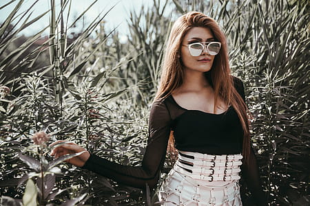 Model Poses Near Bushes Photo thumbnail