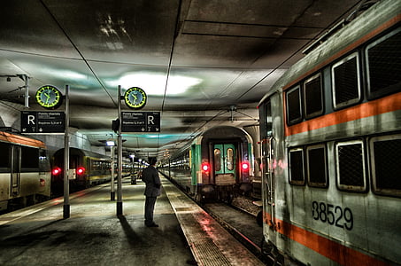 person standing on train station thumbnail