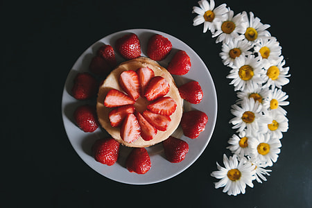 Overhead shot of strawberries and flowers thumbnail