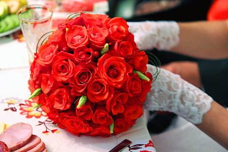 person holding red rose flower bouquet thumbnail