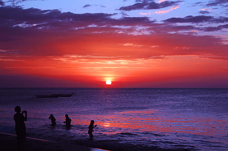 silhouette photography of person on body of water thumbnail