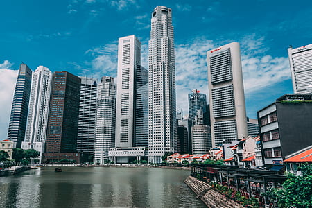 high-rise buildings beside body of water thumbnail