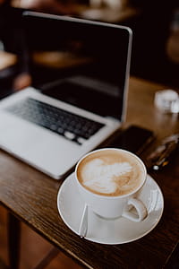 Cup of coffee on table in cafe thumbnail