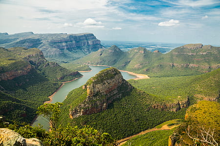 aerial photo of body of water near mountains thumbnail