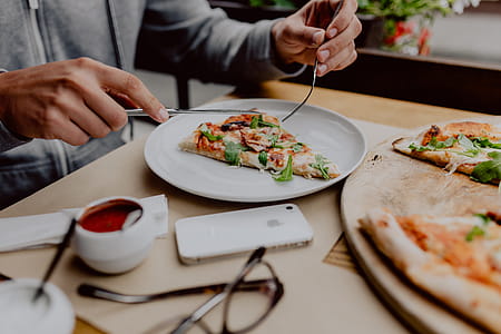 Eating delicious pizza in a cozy restaurant thumbnail