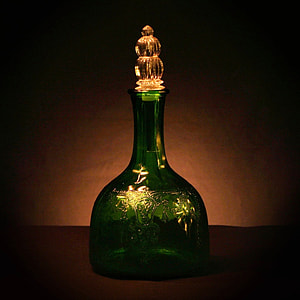 green glass decanter in closeup photo thumbnail
