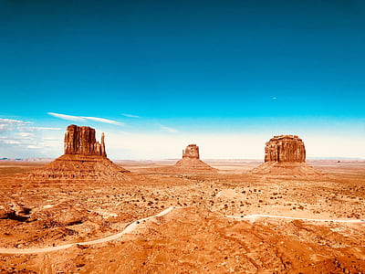 Monument Valley under blue sky thumbnail