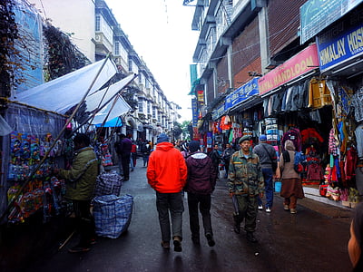 people walking in street with stores thumbnail