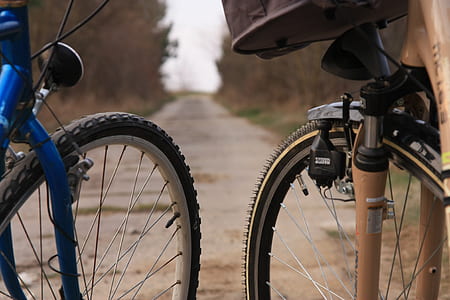 blue and black mountain bicycles thumbnail