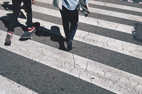 people walking on pedestrian lane during daytime thumbnail