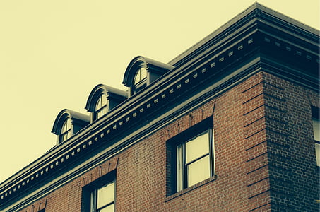 low angle photography of red concrete building thumbnail