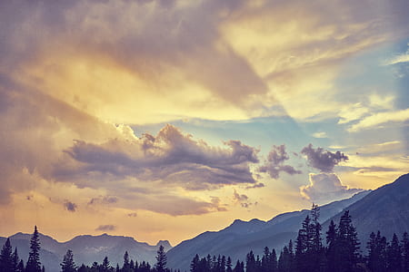 silhouette of mountains and trees thumbnail
