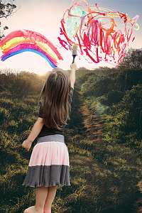 girl holding paint brush thumbnail
