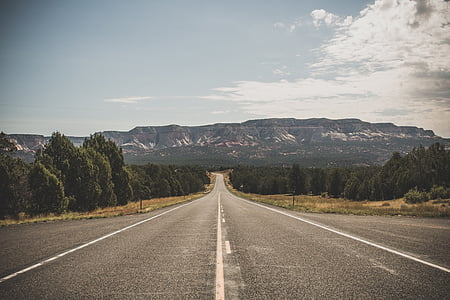 empty gray concrete road near mountain thumbnail