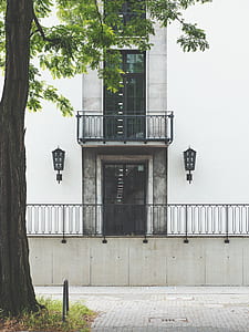 concrete building near green leafed tree thumbnail