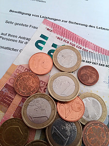 assorted coins and banknotes thumbnail