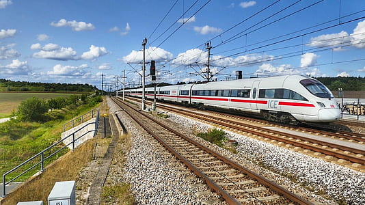 white bullet train travel beside grass thumbnail