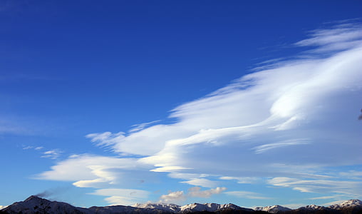mountain covered with snow under cloudy day thumbnail