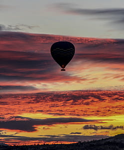silhouette of hotair balloon during dawn thumbnail