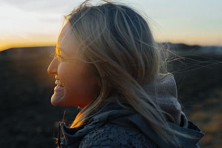 woman facing left while smiling thumbnail