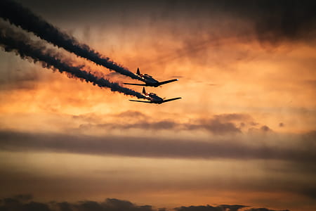 low angle photography of two airplanes thumbnail