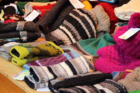 assorted-color-and-design clothes lot on brown surface thumbnail