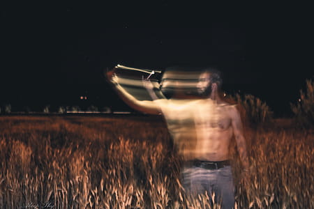 time lapse photography of man raising his right arm thumbnail