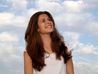 woman wearing white scoop neck shirt during day thumbnail