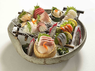 sashimi served on white ceramic pot thumbnail