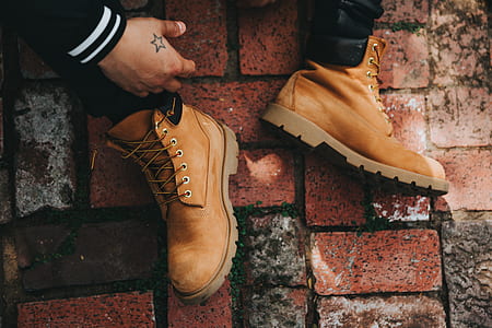 person sitting on brown brick floor thumbnail