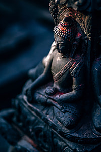 black wooden Buddha statue thumbnail