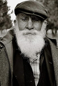 old man facing camera outdoor near trees thumbnail
